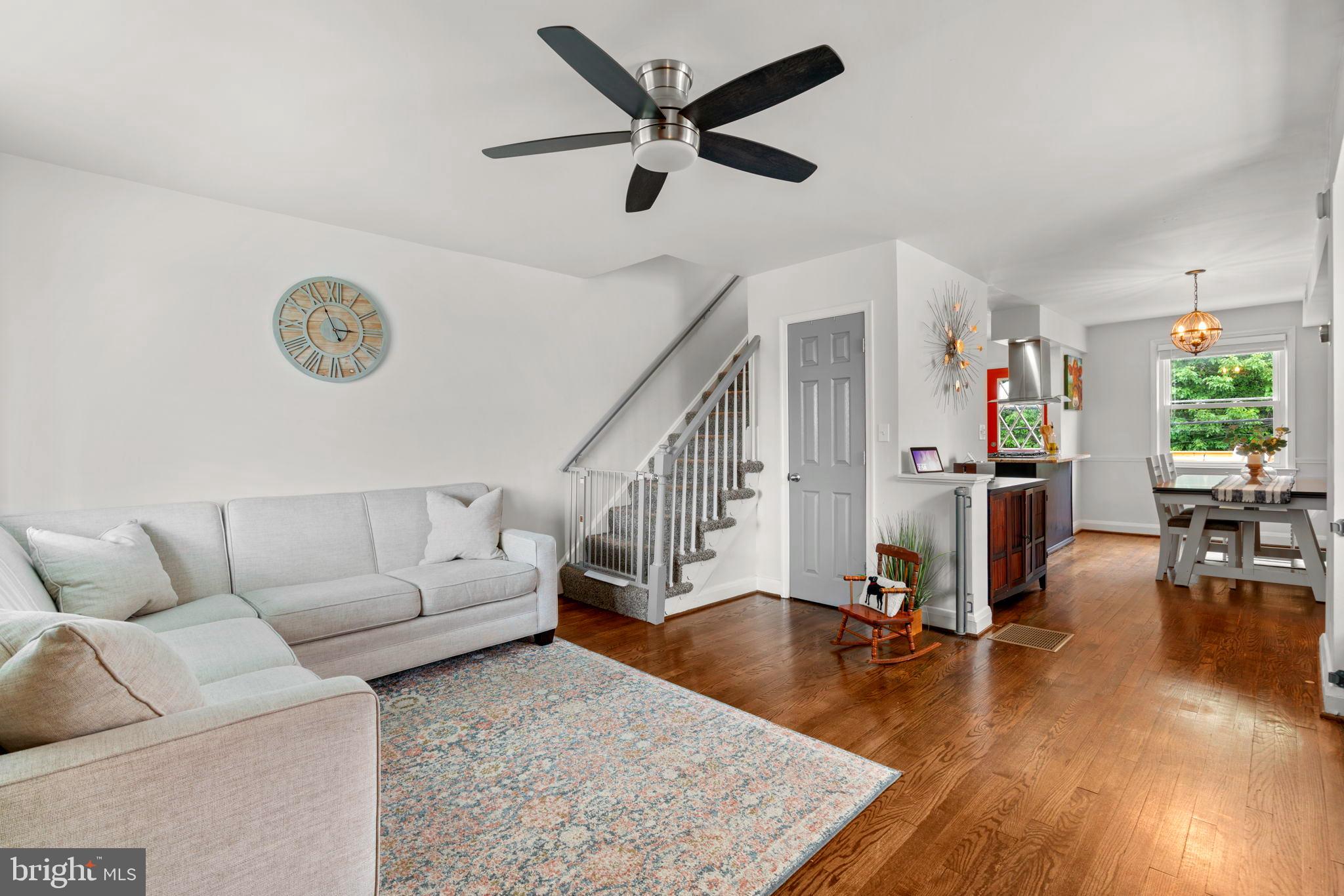 1126 Elm Road Baltimore, MD 21227 - Photo 3 of 30 Open living area with rich hardwood flooring