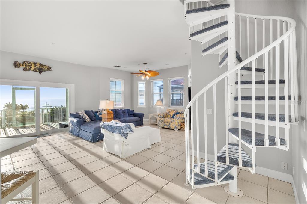 8798 Grand Avenue Boca Grande, FL 33921 - Photo 16 of 64 a living room with furniture and a floor to ceiling window