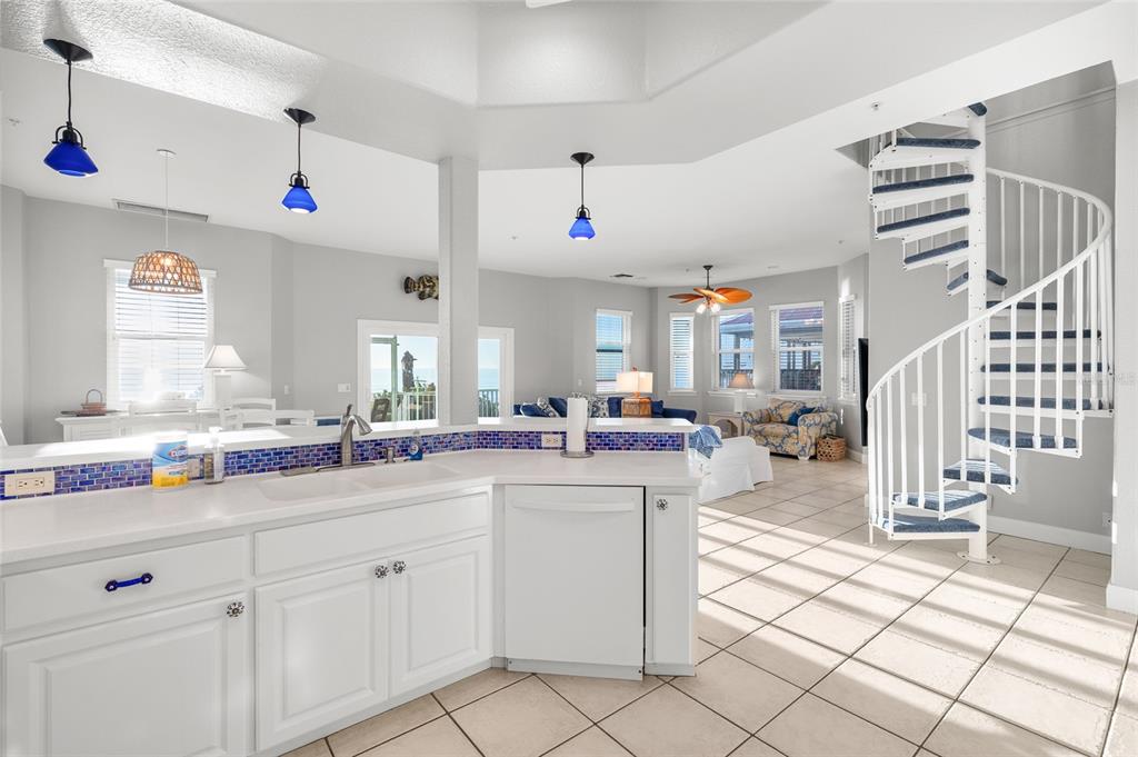 8798 Grand Avenue Boca Grande, FL 33921 - Photo 21 of 64 a kitchen view with cabinets a sink a window and appliances