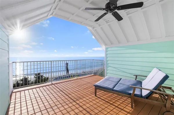 a view of a room with wooden floor and white walls
