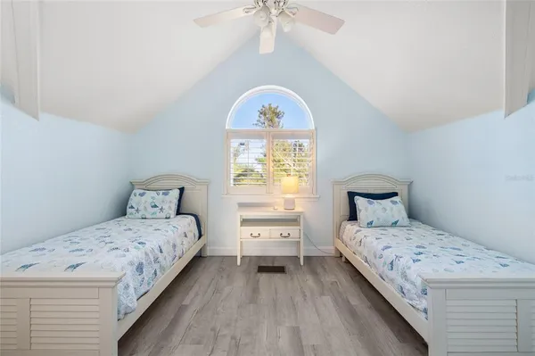 a bathroom with a shower curtain and a shower