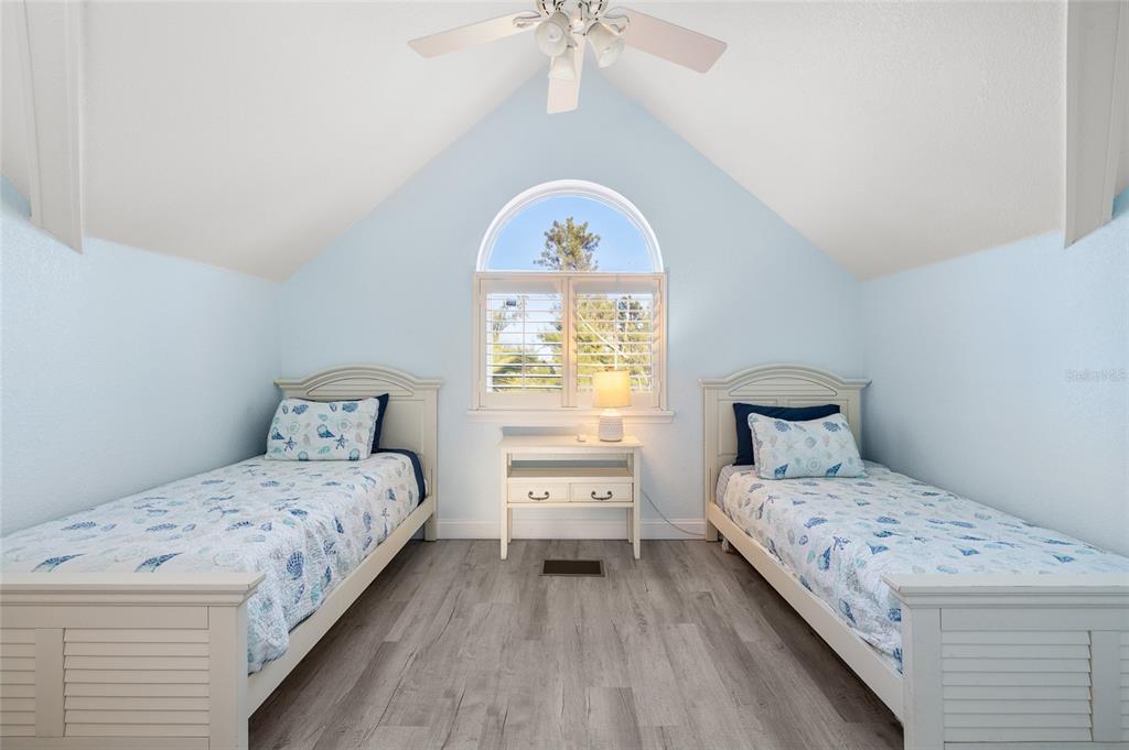 8798 Grand Avenue Boca Grande, FL 33921 - Photo 29 of 64 a bedroom with a bed and a window