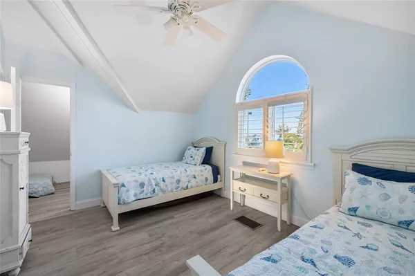 a bedroom with a bed and a couch