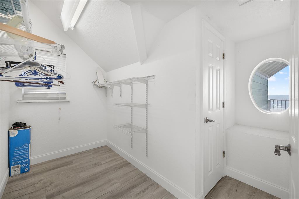 8798 Grand Avenue Boca Grande, FL 33921 - Photo 34 of 64 a view of a room with wooden floor and white walls