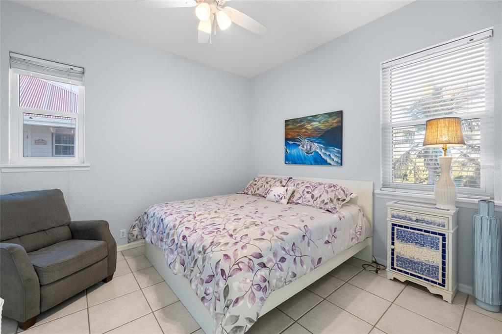 8798 Grand Avenue Boca Grande, FL 33921 - Photo 38 of 64 a bedroom with a bed and a couch