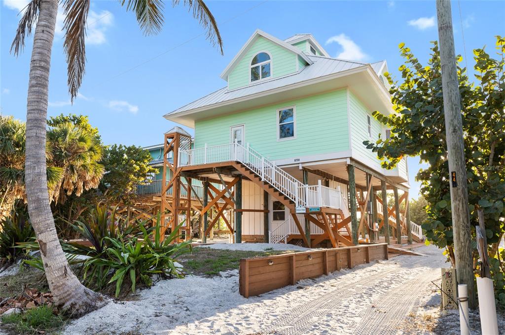 8798 Grand Avenue Boca Grande, FL 33921 - Photo 43 of 64 a view of a house with wooden fence