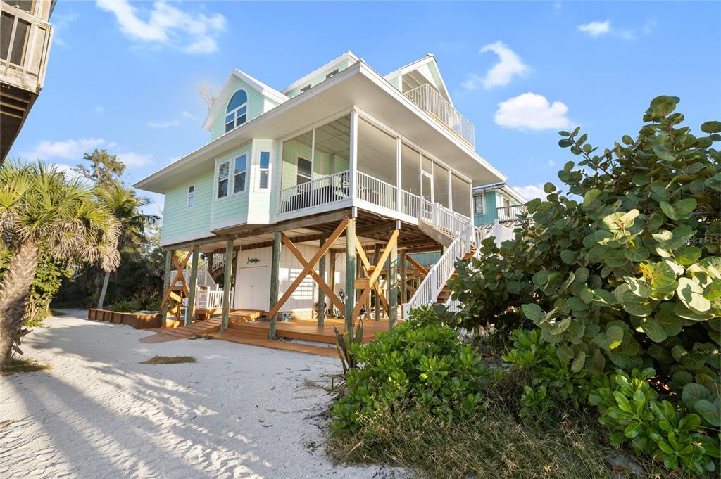 8798 Grand Avenue Boca Grande, FL 33921 - Photo 49 of 64 a view of a large building with a yard