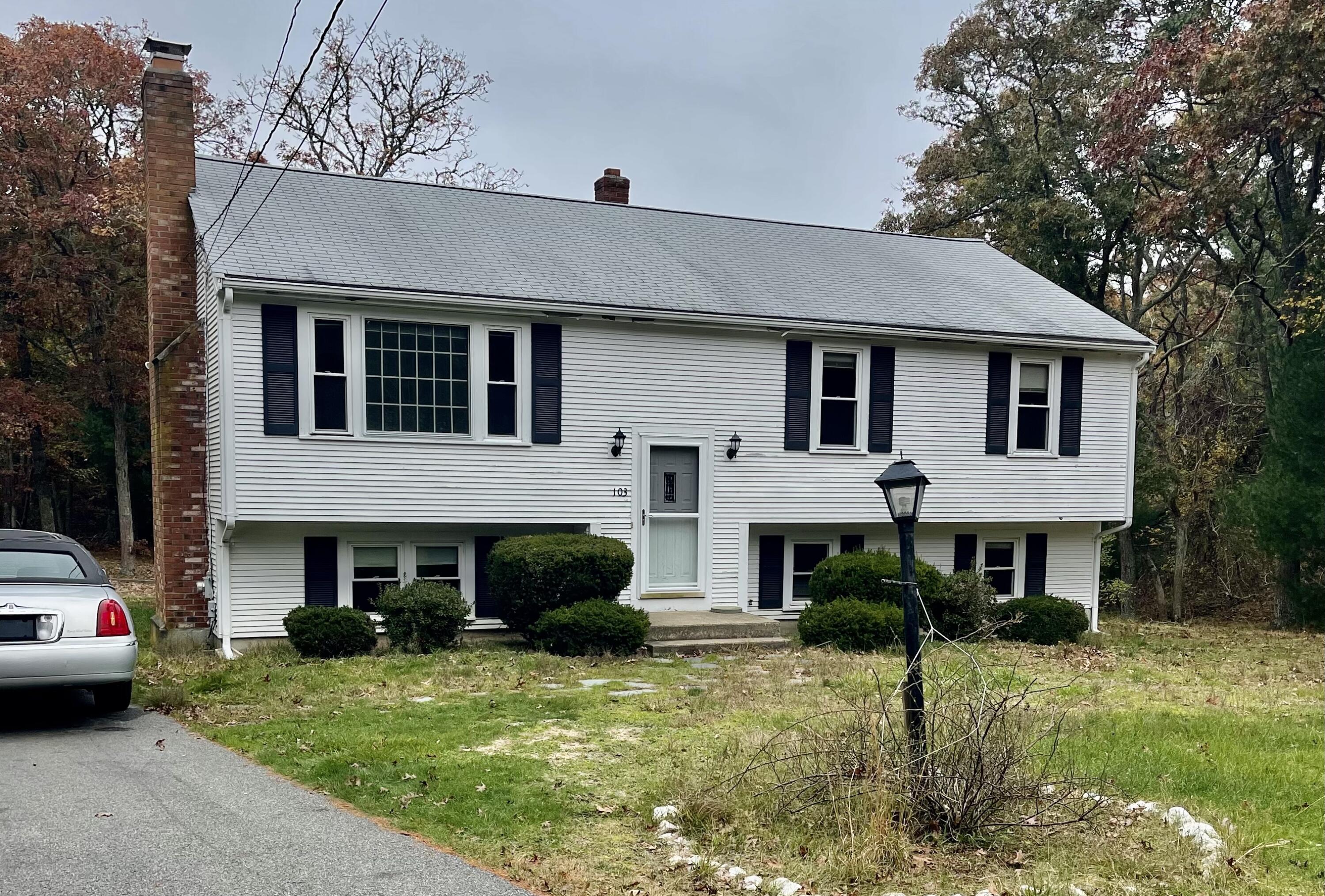 103 Clay Pond Road Bourne, MA 02532 - Photo 1 of 26 a view of a yard in front of a house