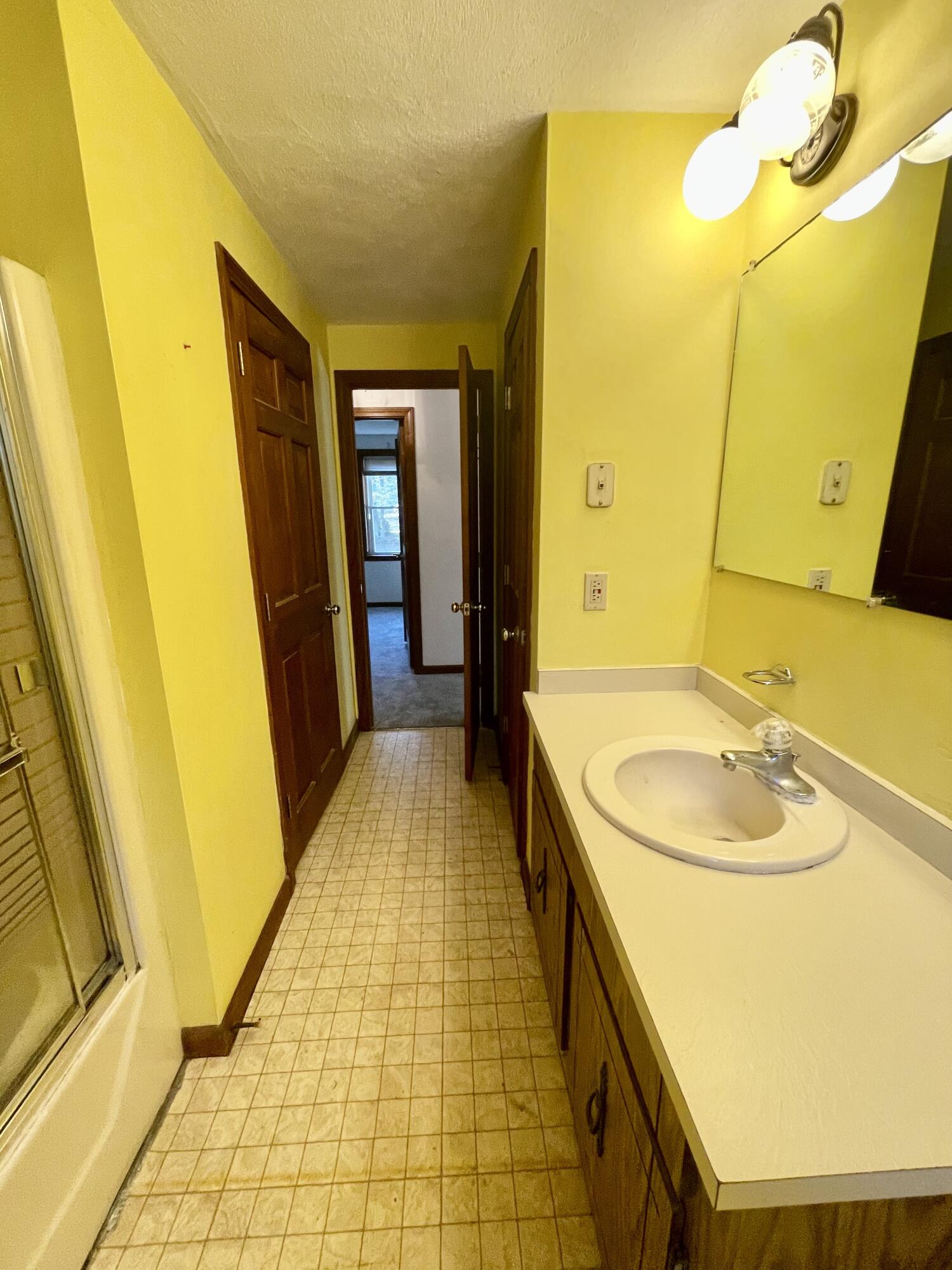 103 Clay Pond Road Bourne, MA 02532 - Photo 12 of 26 a bathroom with a sink and a mirror