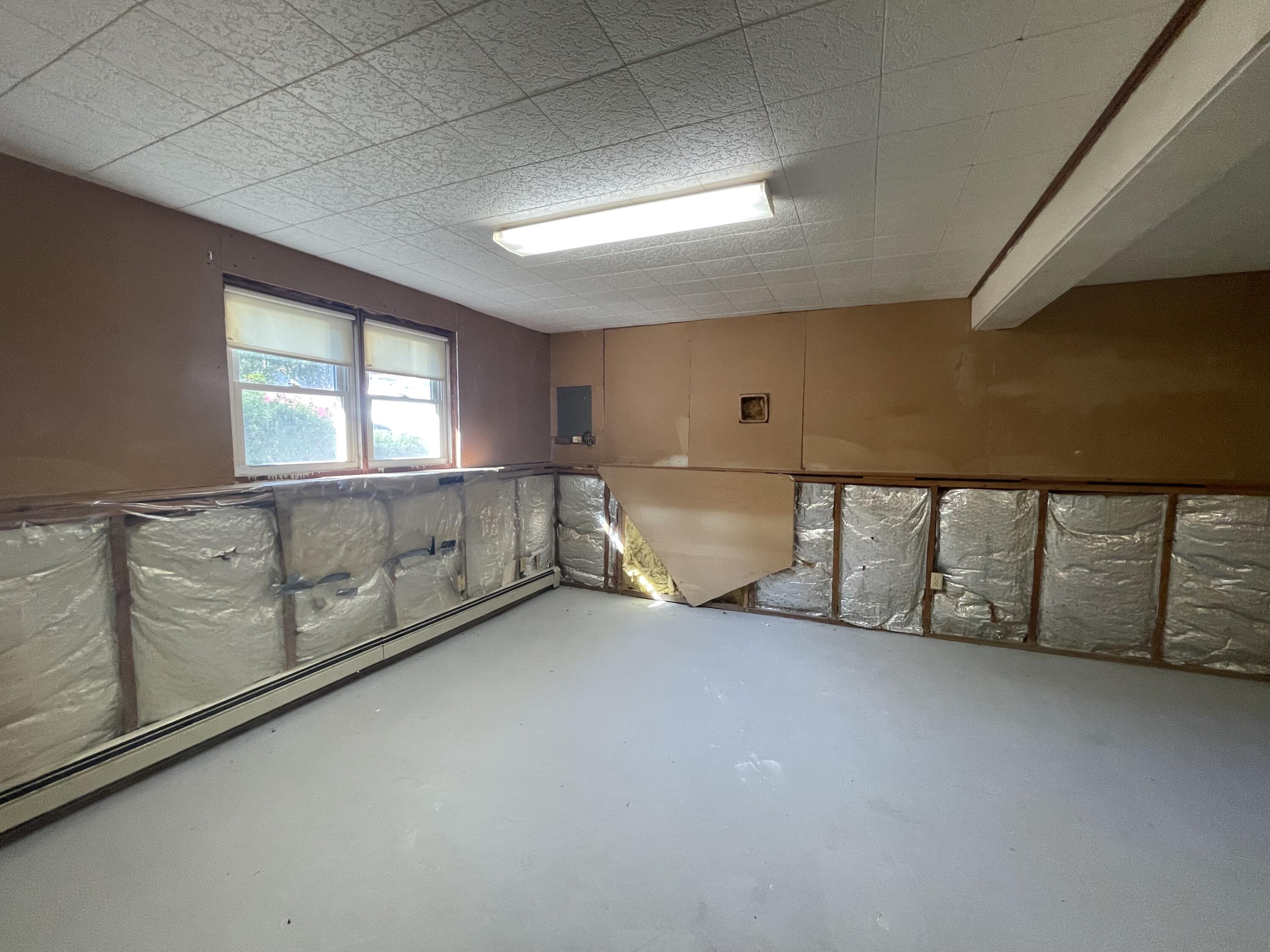 103 Clay Pond Road Bourne, MA 02532 - Photo 19 of 26 an empty room with windows