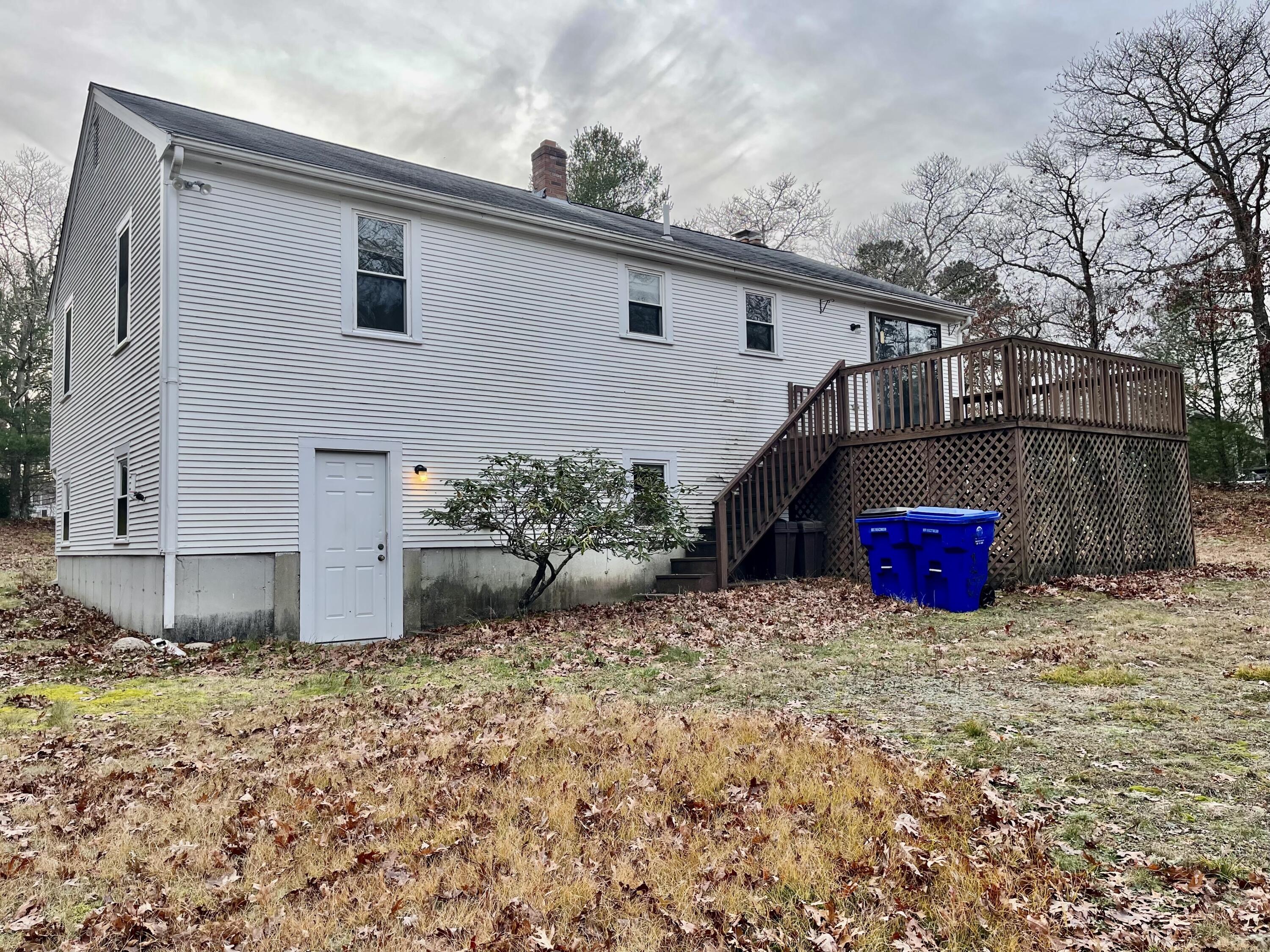 103 Clay Pond Road Bourne, MA 02532 - Photo 3 of 26 a view of a back yard of the house