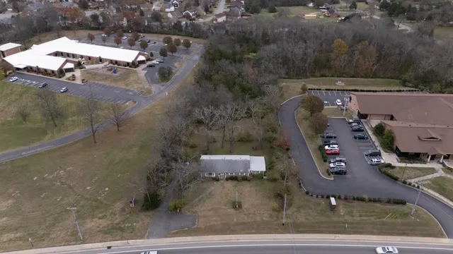 an aerial view of a house with outdoor space