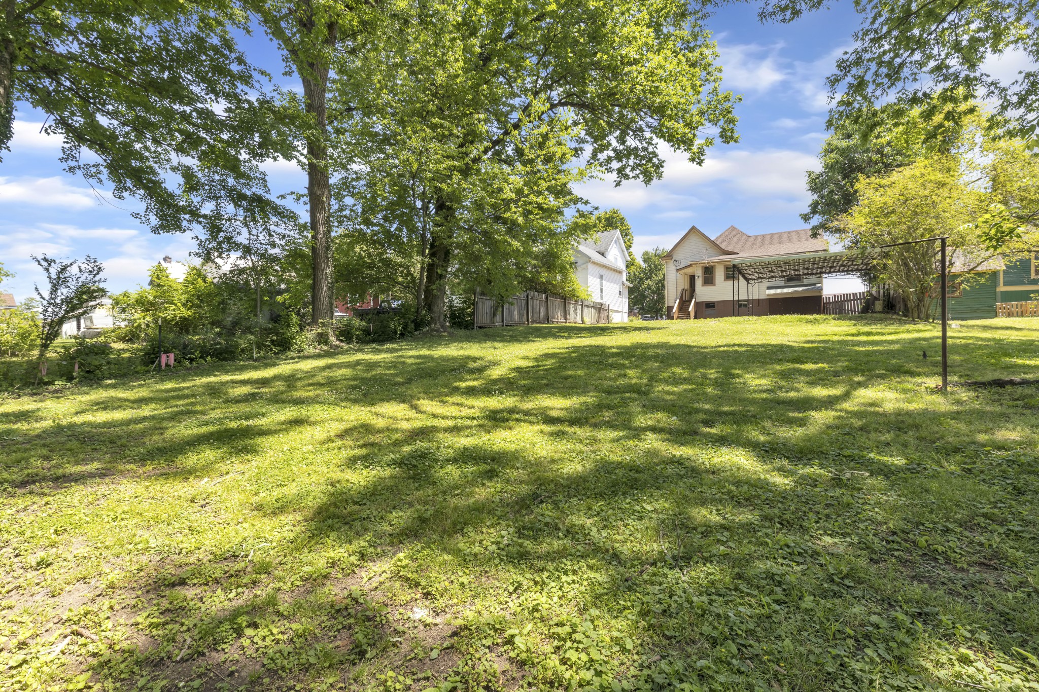 115 North Main Street Springfield, TN 37172 - Photo 6 of 24 a view of a big yard with a house in the background