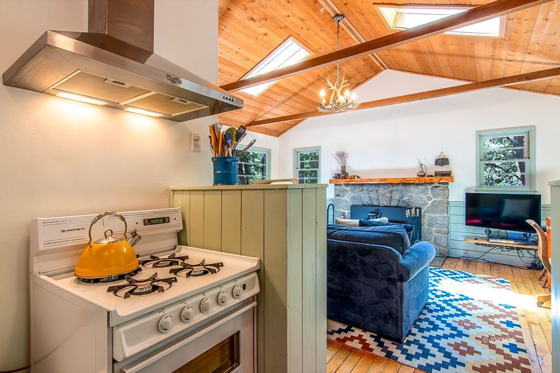 25670 Glen Road Idyllwild, CA 92549 - Photo 14 of 66 a stove top oven sitting inside of a kitchen