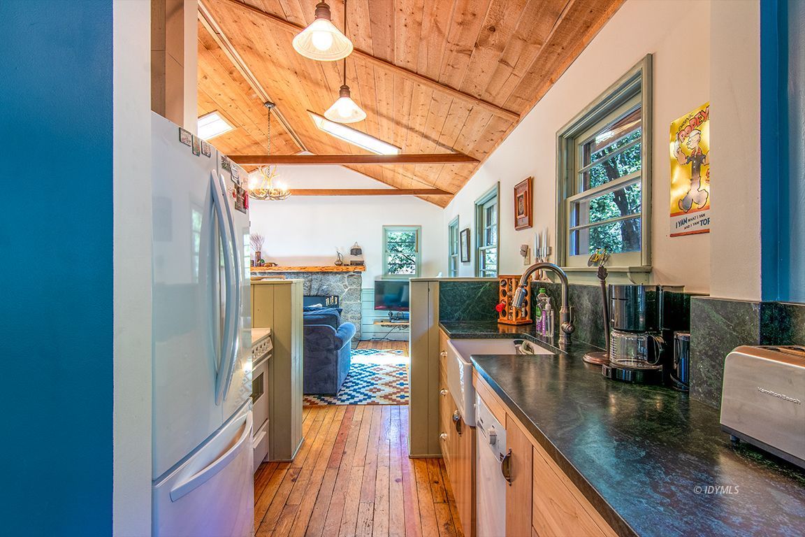 25670 Glen Road Idyllwild, CA 92549 - Photo 15 of 66 a view of a living room and kitchen