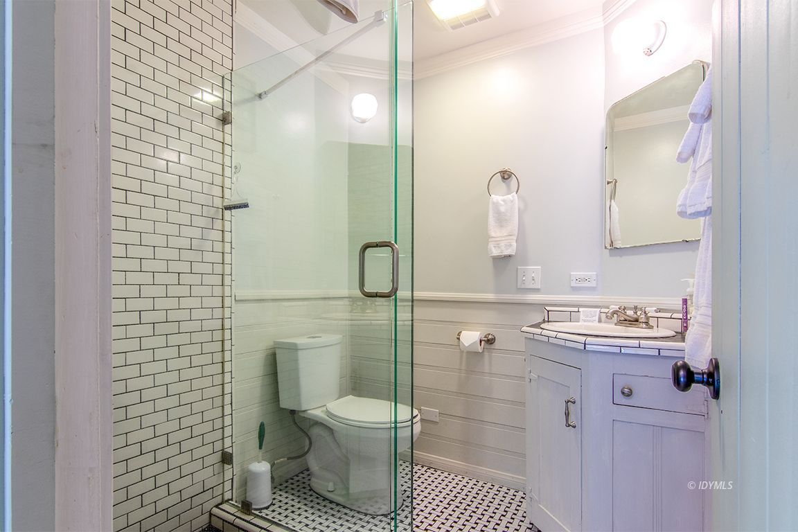 25670 Glen Road Idyllwild, CA 92549 - Photo 20 of 66 a bathroom with a toilet sink and shower