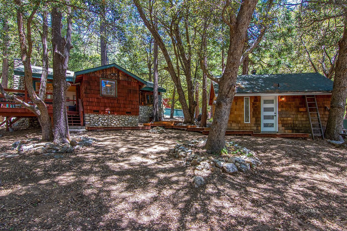 25670 Glen Road Idyllwild, CA 92549 - Photo 28 of 66 a front view of a house with a yard