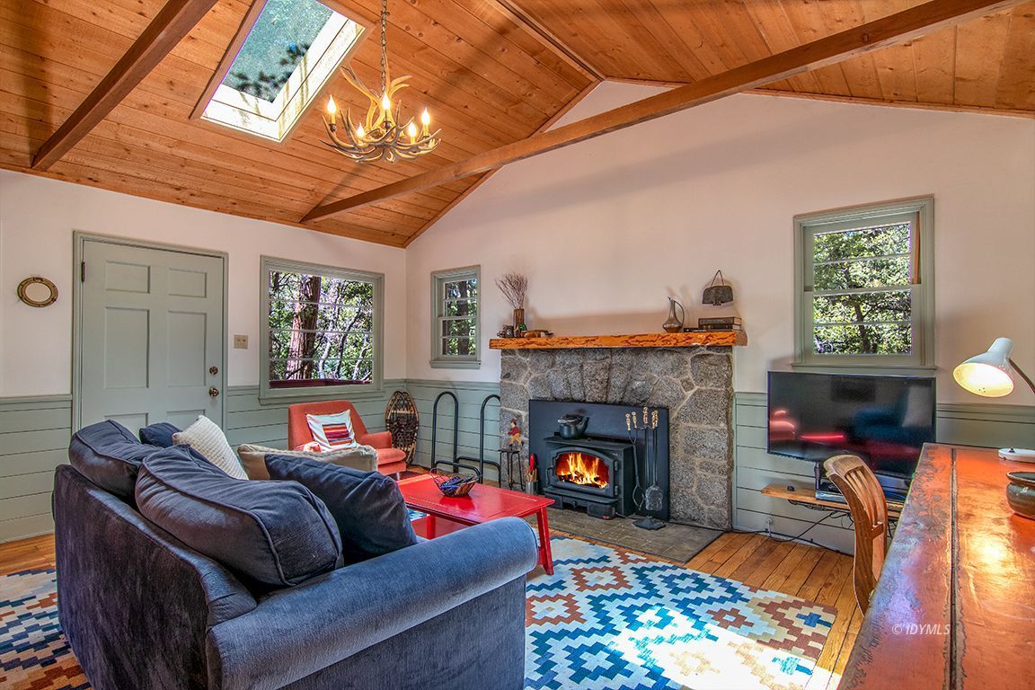 25670 Glen Road Idyllwild, CA 92549 - Photo 4 of 66 a living room with furniture and a fireplace
