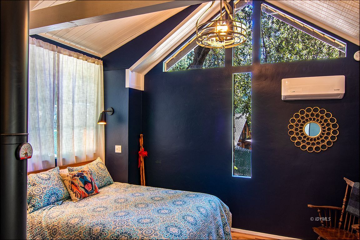 25670 Glen Road Idyllwild, CA 92549 - Photo 45 of 66 a bedroom with a bed and a window
