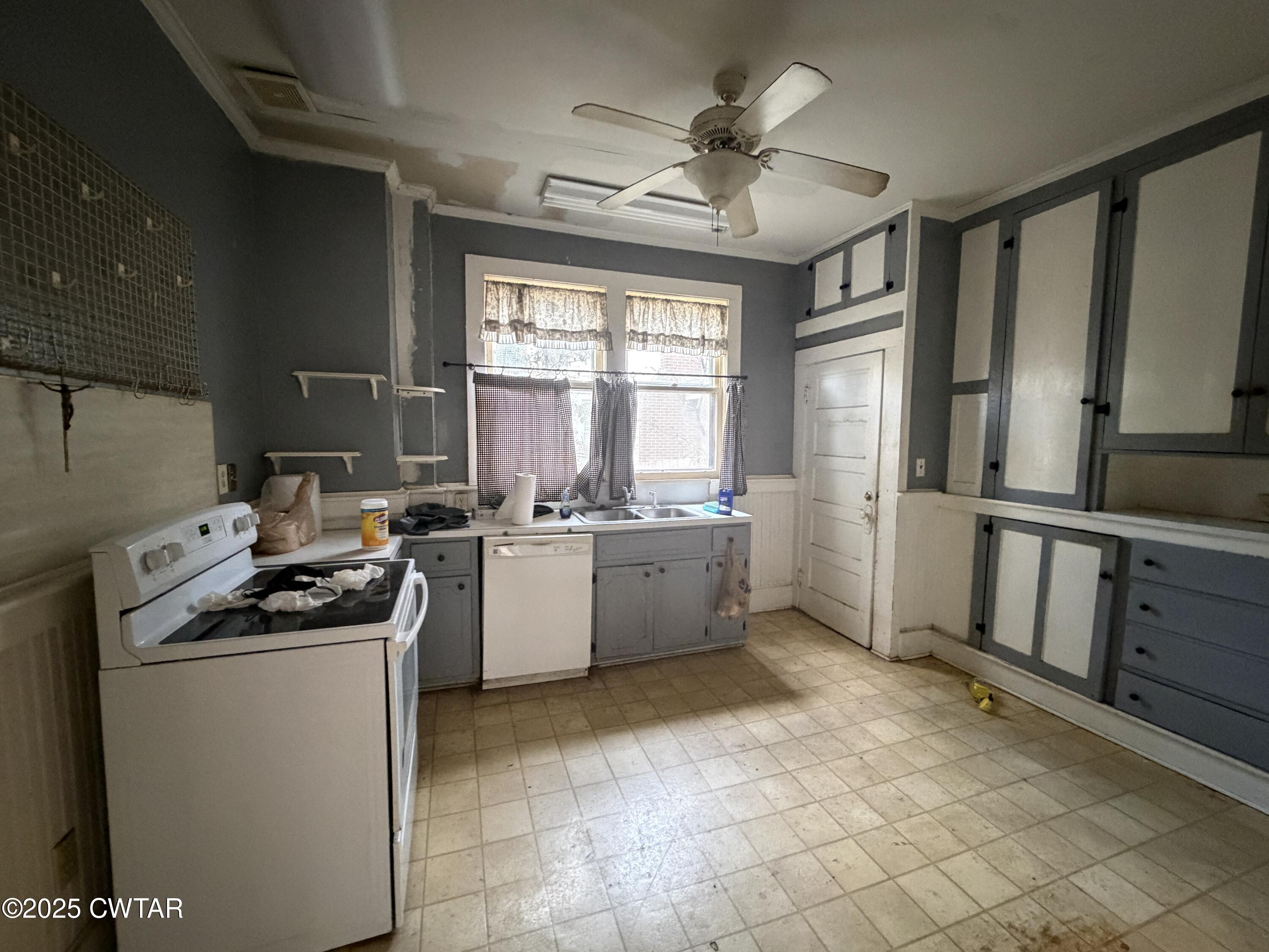 400 West Grand Street Jackson, TN 38301 - Photo 7 of 13 a kitchen with a sink appliances and cabinets