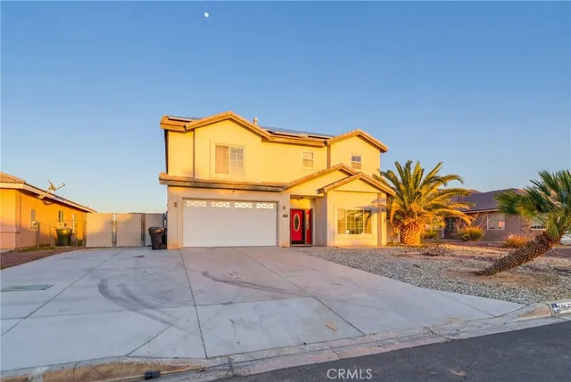a view of a house with a road