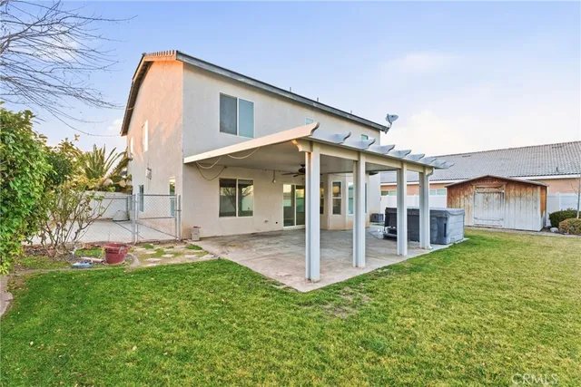 a front view of a house with a yard and porch