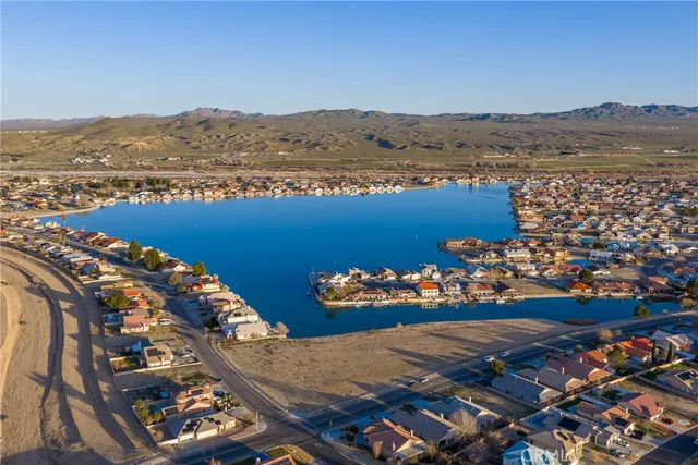 an aerial view of a house with a ocean view