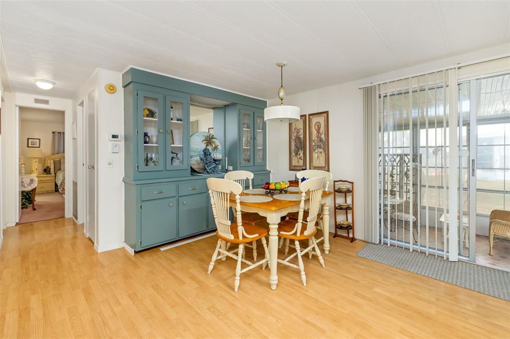 5619 Bayshore Road, Unit 423 Palmetto, FL 34221 - Photo 11 of 55 a view of a dining room with furniture window and wooden floor