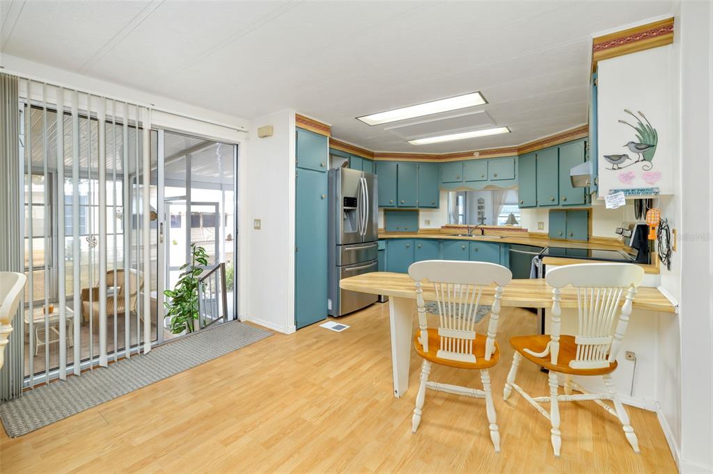 5619 Bayshore Road, Unit 423 Palmetto, FL 34221 - Photo 12 of 55 a dining room with furniture and a large window