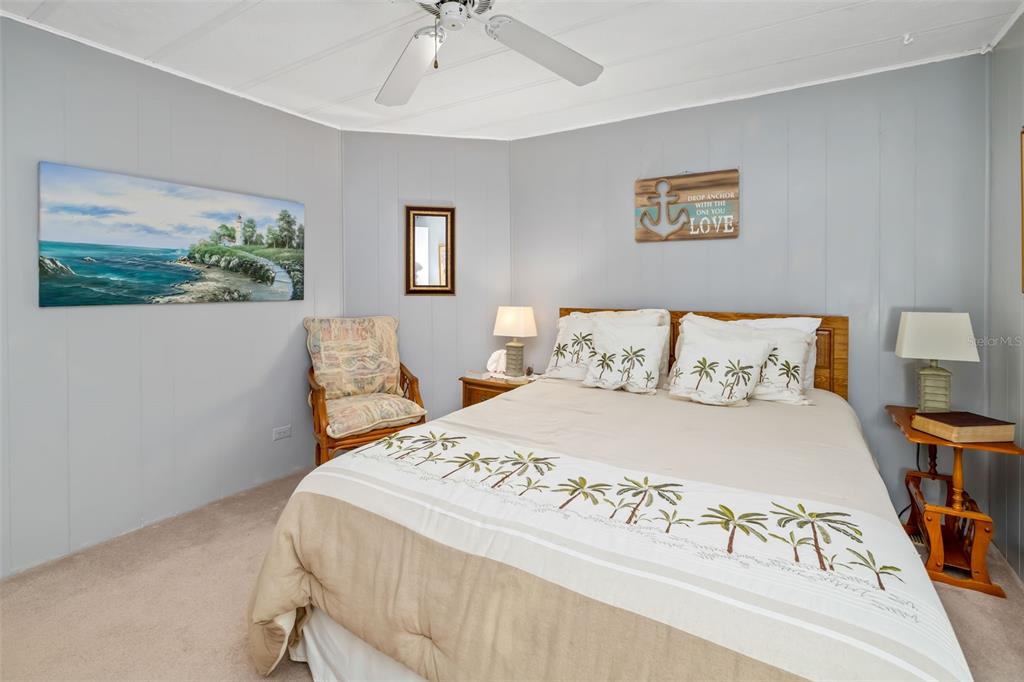 5619 Bayshore Road, Unit 423 Palmetto, FL 34221 - Photo 19 of 55 a bedroom with a bed and a painting on the wall