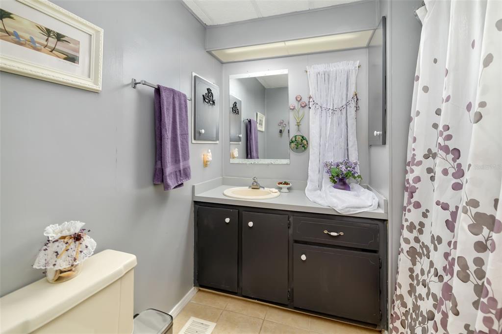 5619 Bayshore Road, Unit 423 Palmetto, FL 34221 - Photo 20 of 55 a bathroom with a sink and a mirror