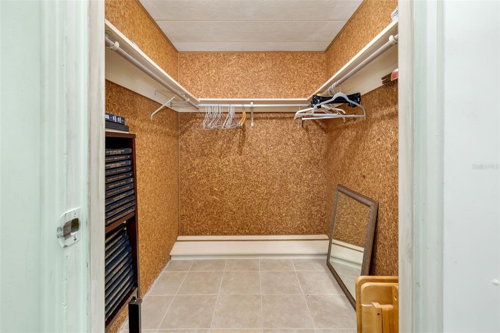 5619 Bayshore Road, Unit 423 Palmetto, FL 34221 - Photo 27 of 55 a view of walk in closet with clothes and shoes