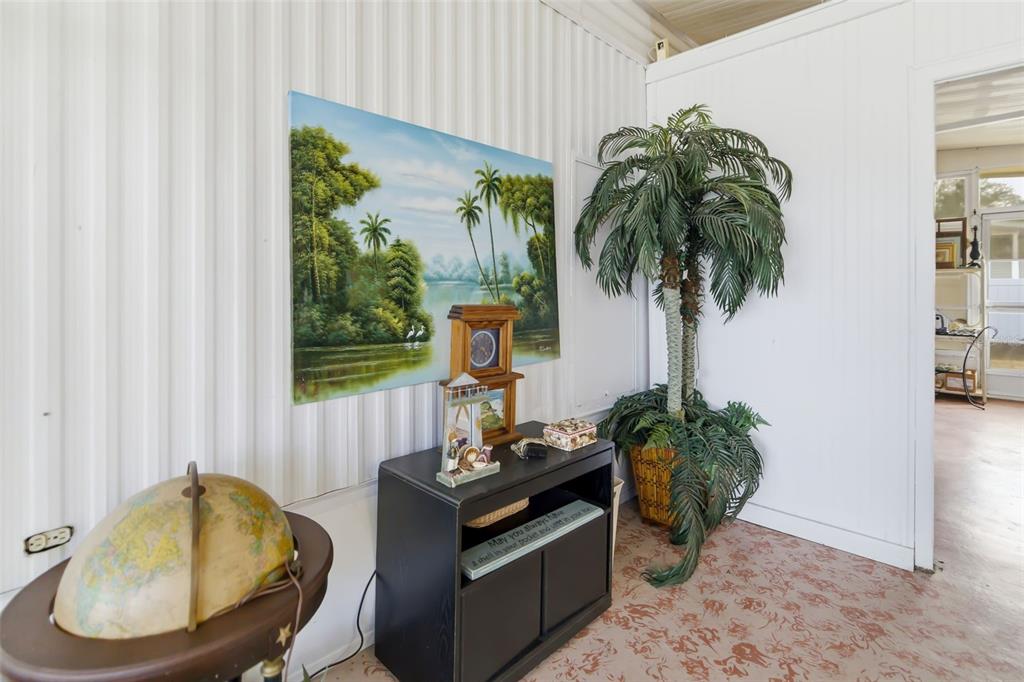 5619 Bayshore Road, Unit 423 Palmetto, FL 34221 - Photo 30 of 55 a living room with furniture and a potted plant