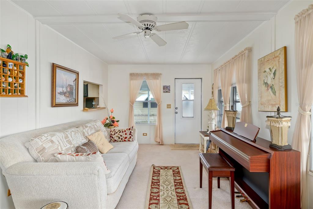 5619 Bayshore Road, Unit 423 Palmetto, FL 34221 - Photo 3 of 55 a living room with furniture and wooden floor