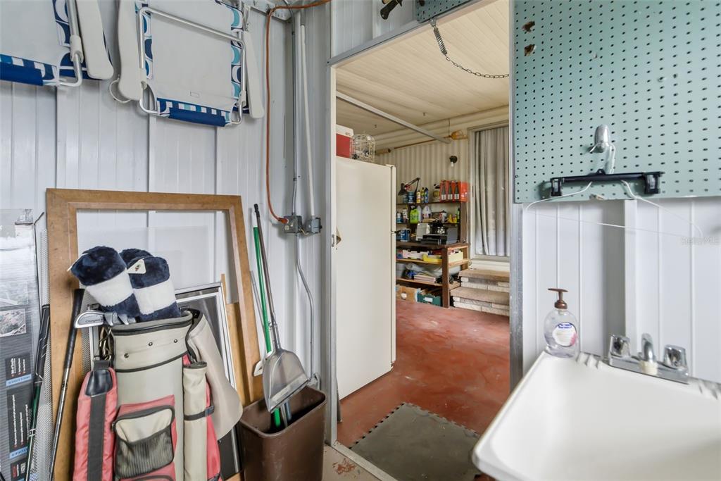 5619 Bayshore Road, Unit 423 Palmetto, FL 34221 - Photo 36 of 55 a hallway with a stove and a white couch