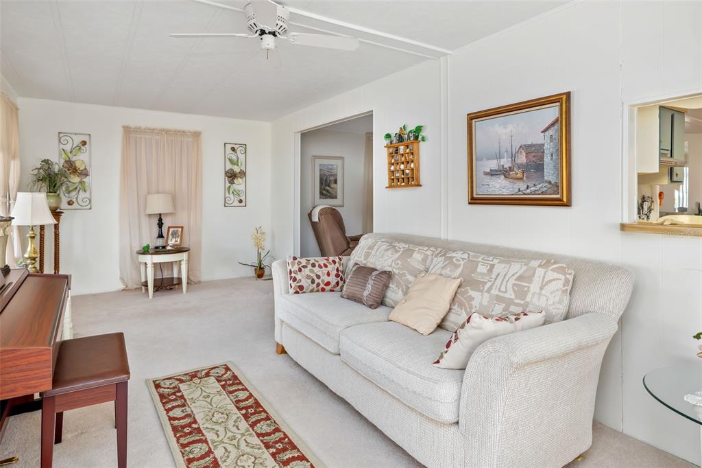 5619 Bayshore Road, Unit 423 Palmetto, FL 34221 - Photo 7 of 55 a living room with furniture and a rug
