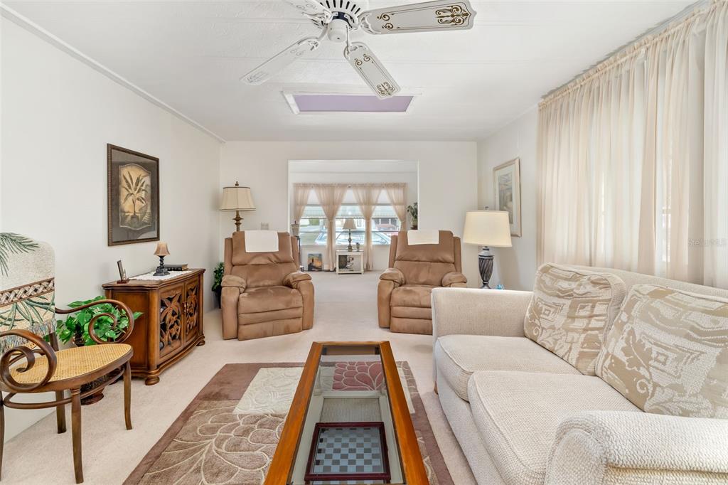 5619 Bayshore Road, Unit 423 Palmetto, FL 34221 - Photo 9 of 55 a living room with furniture and a rug