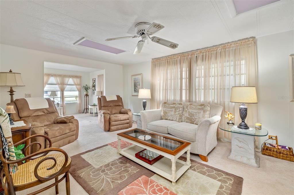 5619 Bayshore Road, Unit 423 Palmetto, FL 34221 - Photo 10 of 55 a living room with furniture and a large window