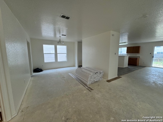 4622 Rothberger Way San Antonio, TX 78244 - Photo 11 of 23 an empty room with windows and cabinet