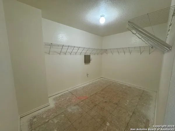 a view of a room with racks on the wall