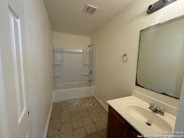4622 Rothberger Way San Antonio, TX 78244 - Photo 20 of 23 a bathroom with a sink a toilet and shower