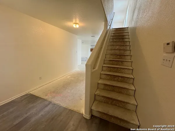 a view of entryway with wooden floor
