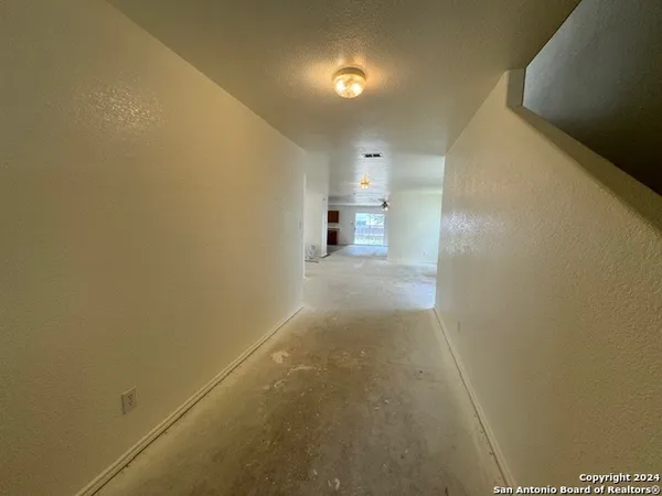 a view of a room with a hallway