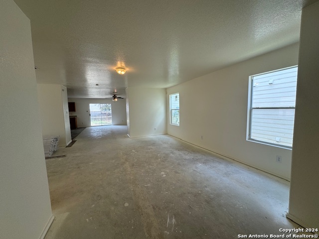 4622 Rothberger Way San Antonio, TX 78244 - Photo 10 of 23 a view of empty room with windows and fireplace