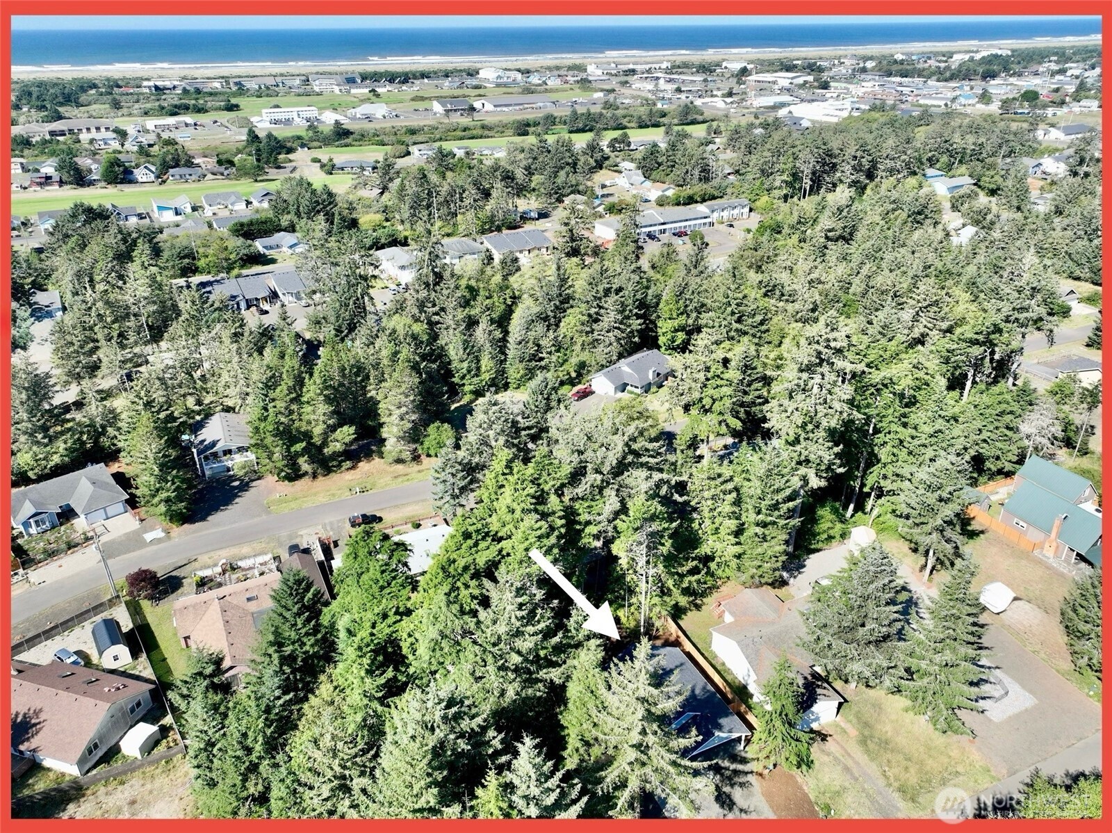 611 Weatherwax Loop Northeast Ocean Shores, WA 98569 - Photo 12 of 39 an aerial view of residential house with outdoor space and trees all around