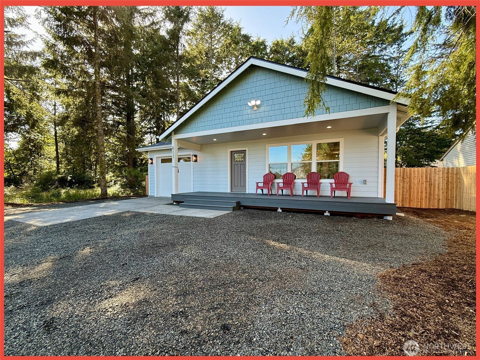 611 Weatherwax Loop Northeast Ocean Shores, WA 98569 - Photo 14 of 39 a view of a house with backyard and trees