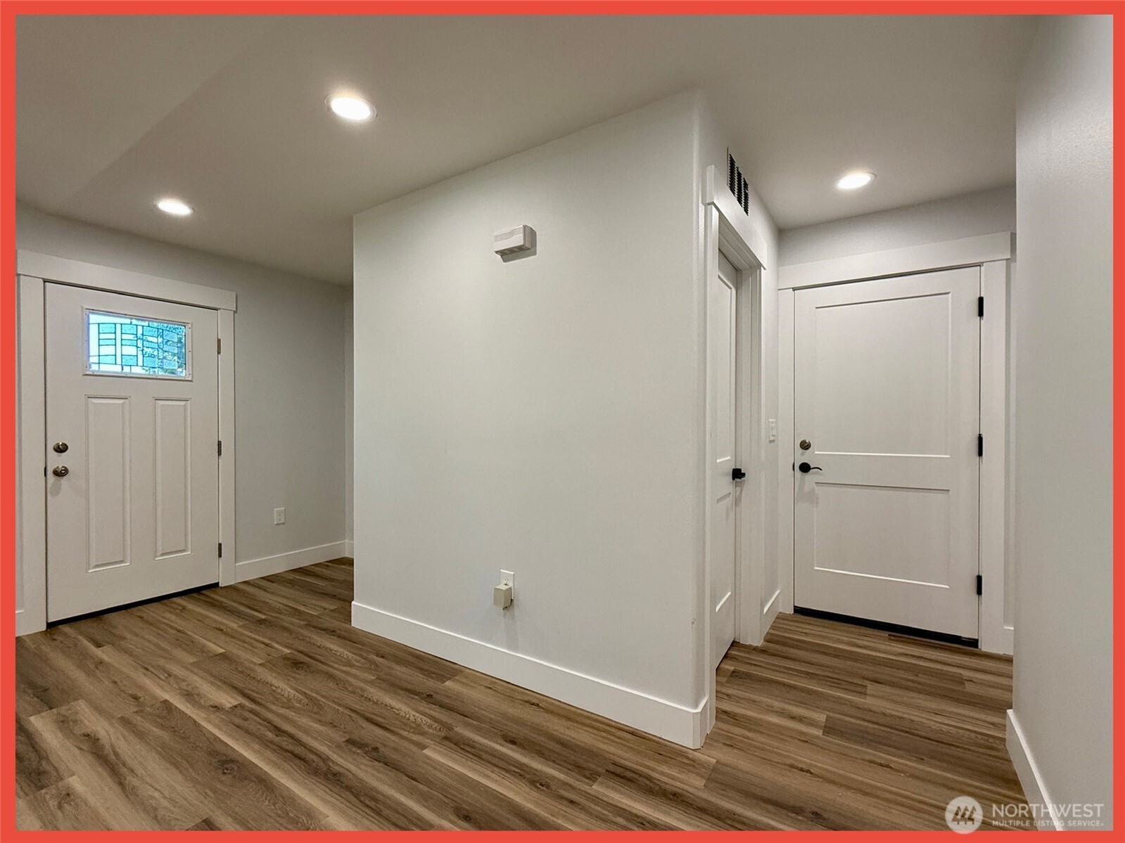 611 Weatherwax Loop Northeast Ocean Shores, WA 98569 - Photo 26 of 39 a view of a hallway with wooden floor