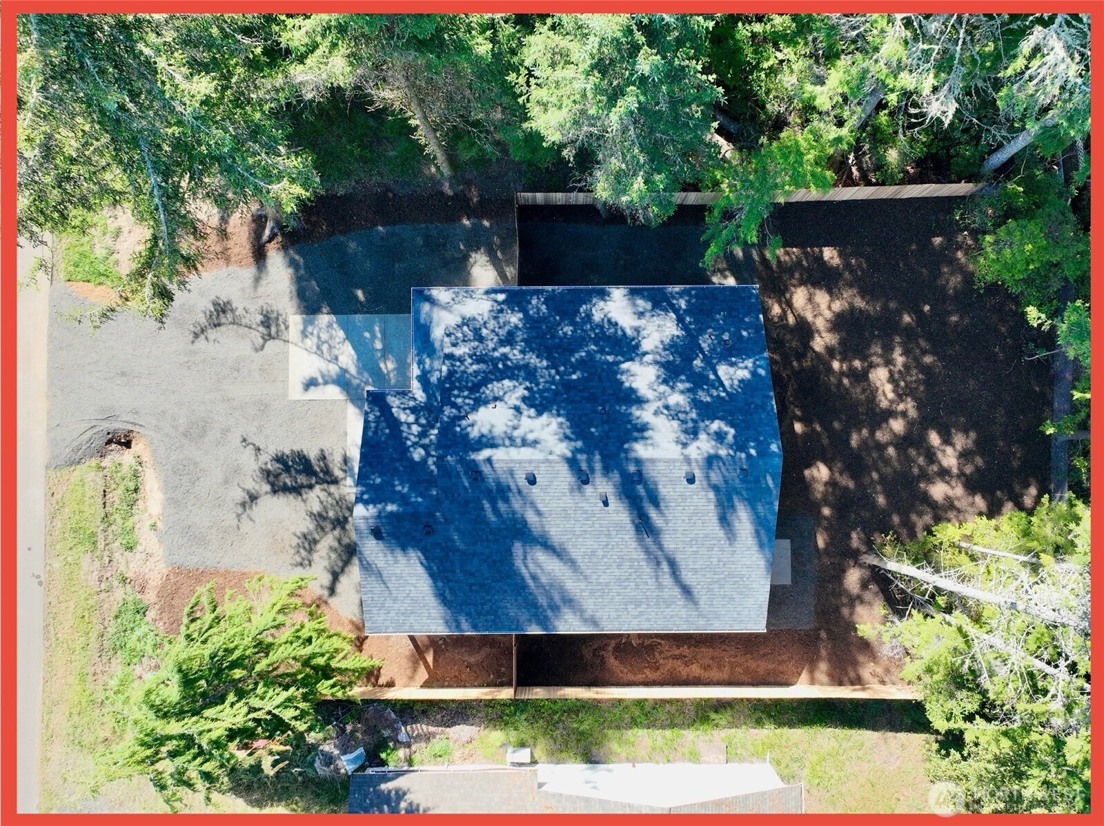 611 Weatherwax Loop Northeast Ocean Shores, WA 98569 - Photo 3 of 39 an aerial view of a house with a yard