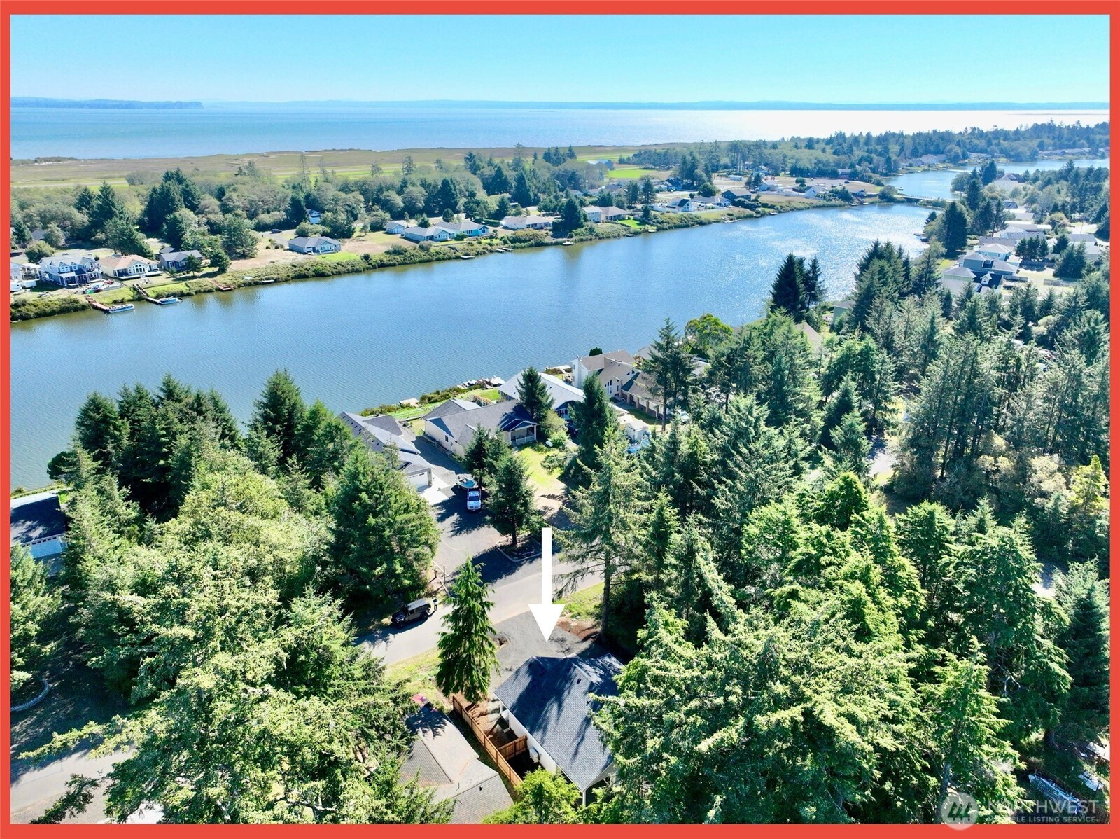 611 Weatherwax Loop Northeast Ocean Shores, WA 98569 - Photo 5 of 39 an aerial view of residential houses with outdoor space and lake view
