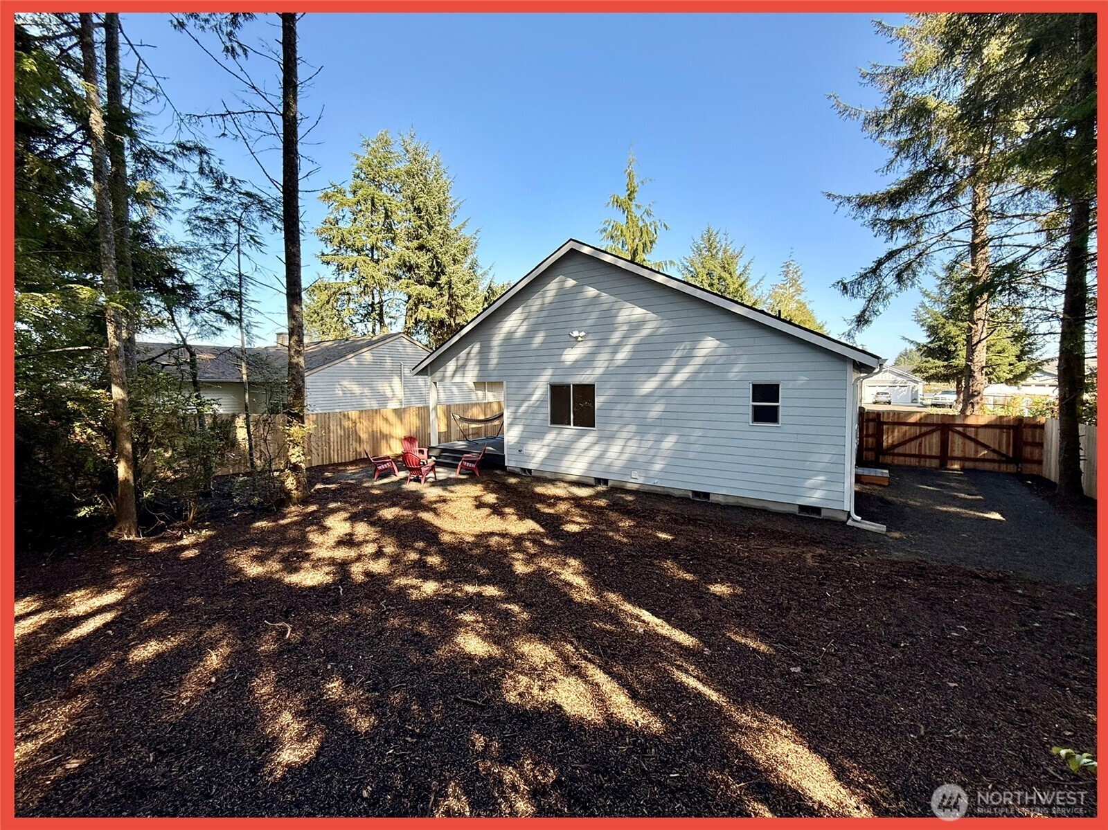611 Weatherwax Loop Northeast Ocean Shores, WA 98569 - Photo 6 of 39 a front view of a house with a yard